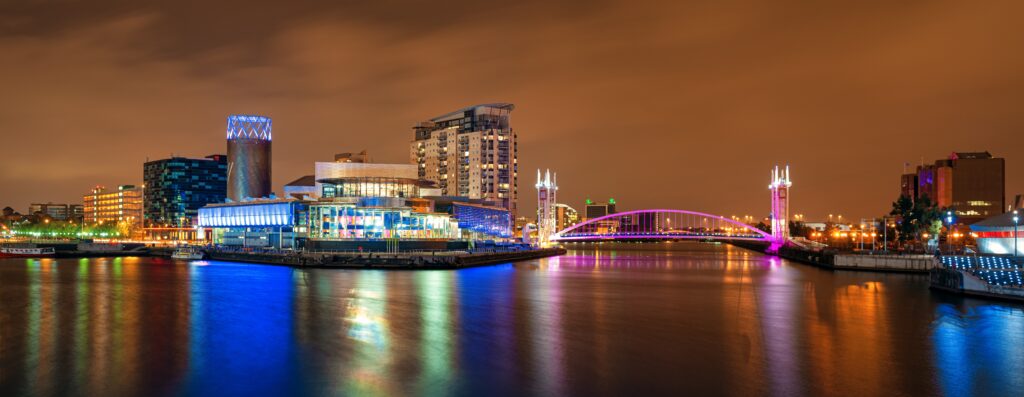 Salford Quays business district at night in in Manchester, England, United Kingdom