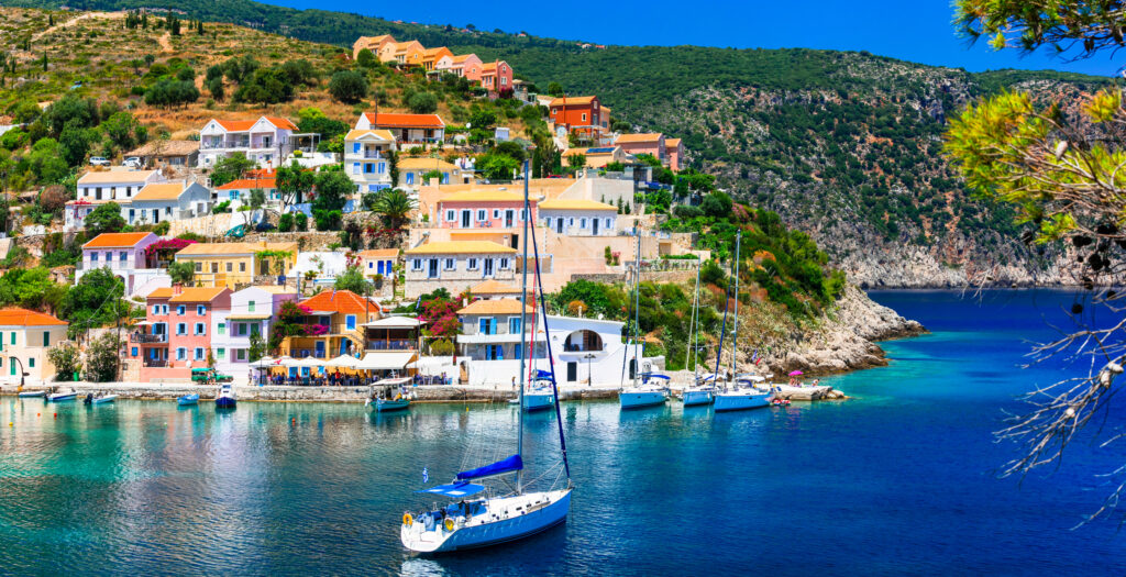 Picturesque Assos village, view with colorful houses and azure sea, Kefalonia island, Greece