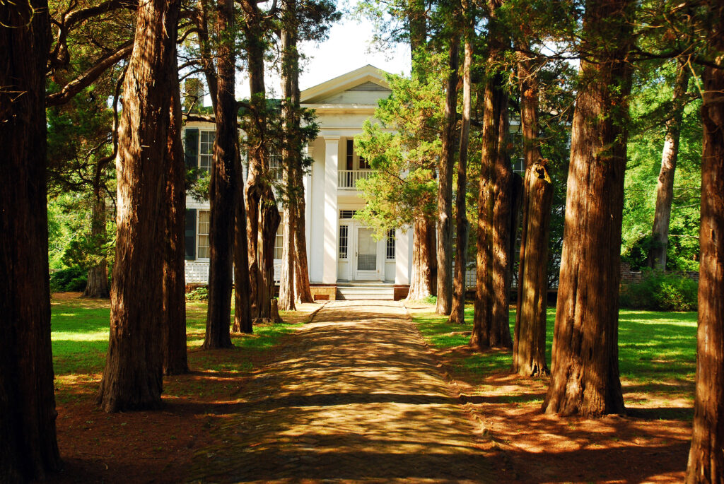 A tree lined path leads to Rowan Oak, William Faulkner`s home in Oxford, Mississippi