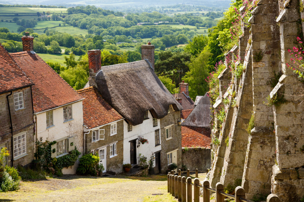 Famous view of Picturesque cottages on cobbled street at Gold Hill, Shaftestbury Dorset England