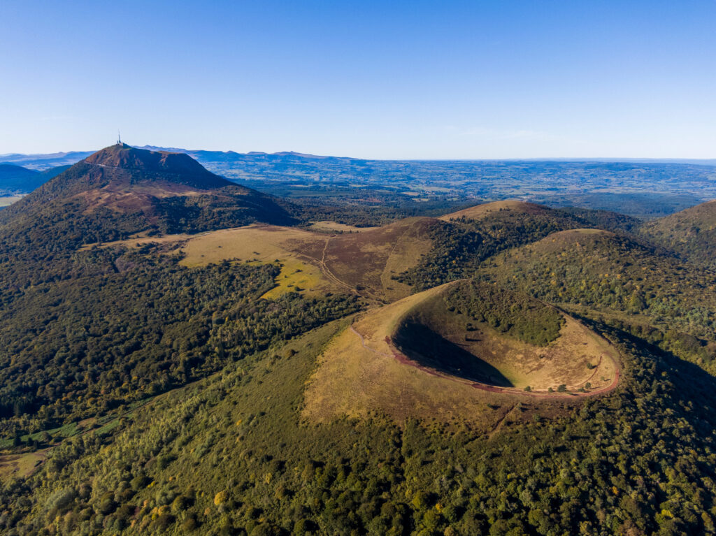 Aerial panorama of Puy Pariou and Puy de Dome volcanoes, Auvergne-Rhone-Alpes, France