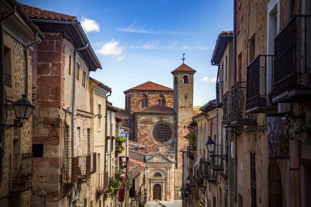 View of the side facade of the Sigüenza Cathedral, Guadalajara, Castilla-la Manha, Spain, from the Calle Mayor of the old town