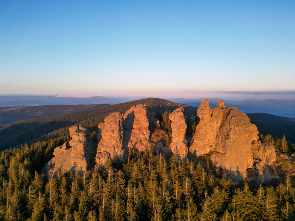 The warm sunset light over the rocks of the 12 Apostoli reserve in the Calimani mountains, Romania