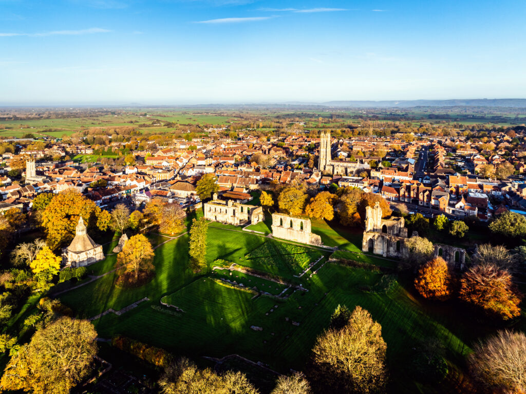 Sunrise over Glastonbury Abbey from a drone, Glastonbury, Somerset, England
