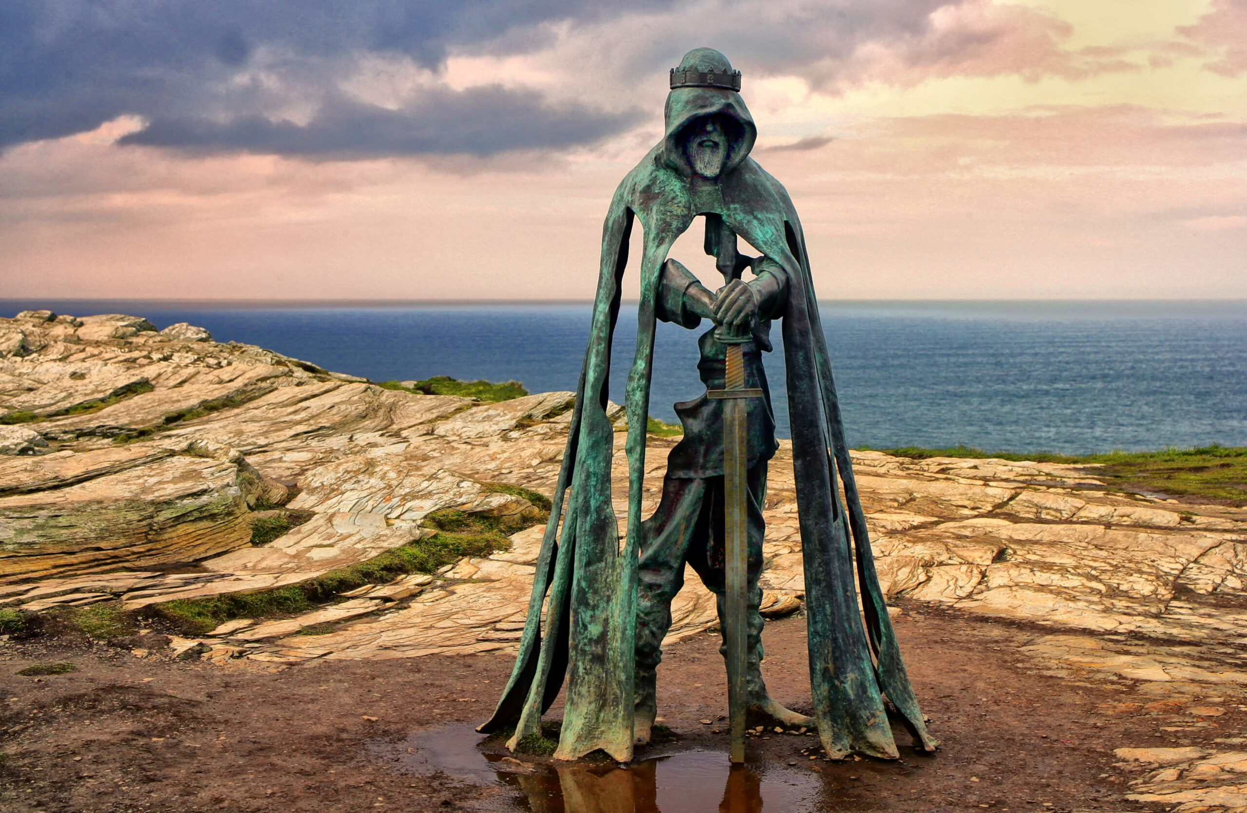 The King Arthur statue Gallos by Rubin Eynon stands on a rocky headland on the Atlantic coast of Cornwall