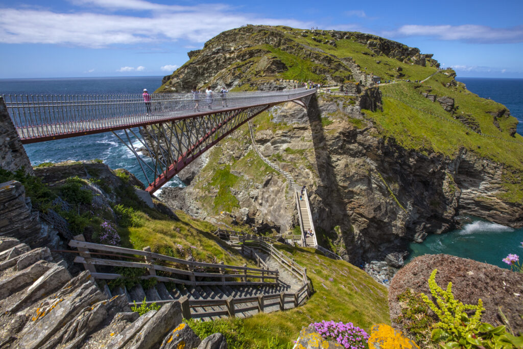 A view of the stunning bridge and picturesque scenery at Tintagel Castle in Cornwall, UK