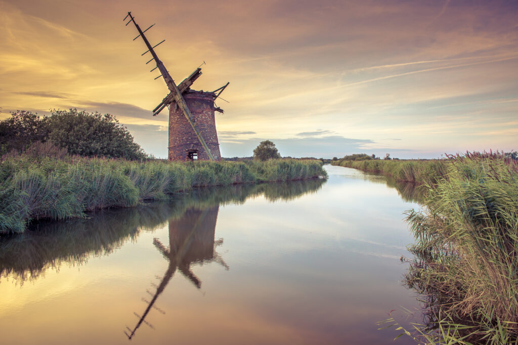 Traditional norfolk windmill on the Norfolk Broads at sunset