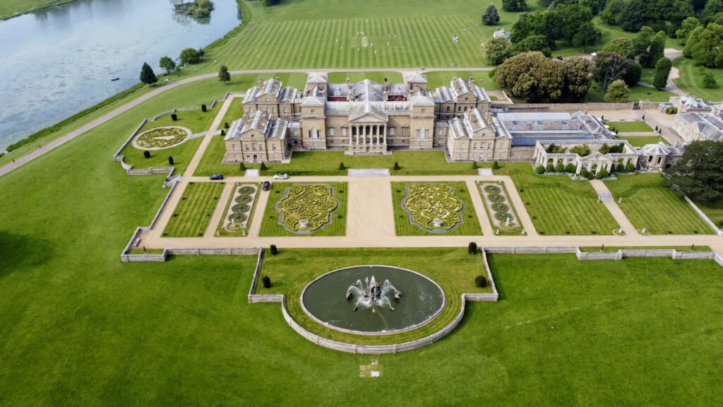 An aerial shot of the Holkham Hall and surrounding grounds in the UK