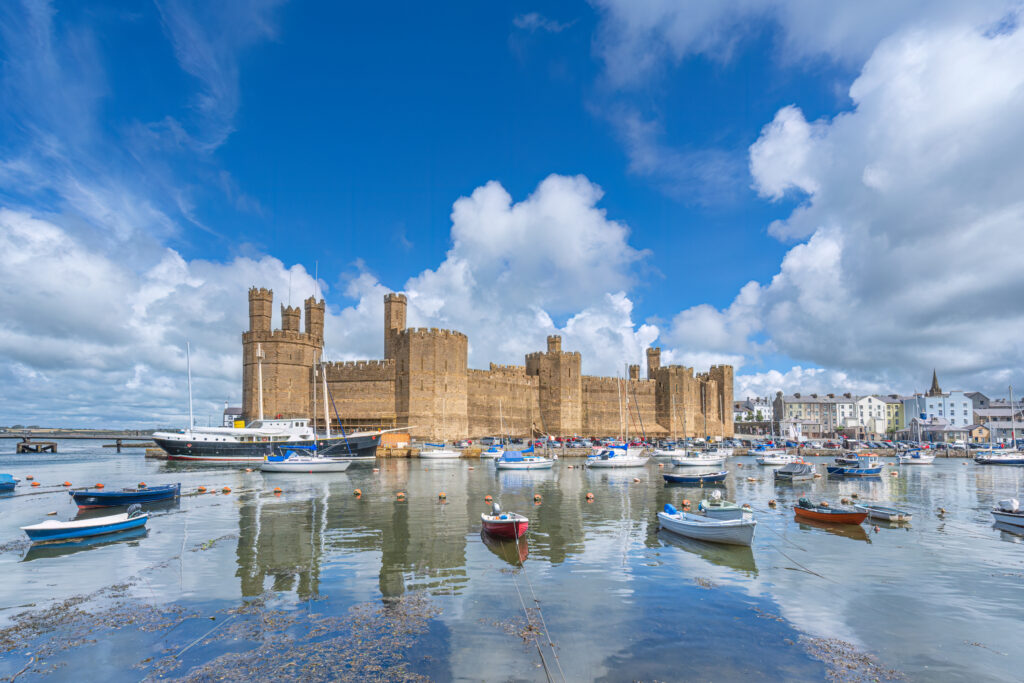 Caernarfon Castle on the River Seiont overlooking the Menai Strait in North Wales