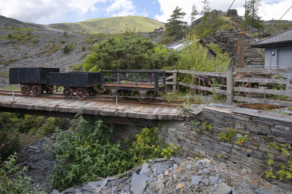 Landscape and historical mining cars at a slate mine. Wales, Gwynedd, Llechwedd