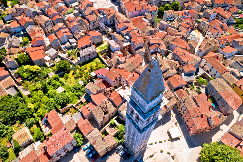 Town of Vodnjan tower and rooftops aerial view, highest tower in Istria region of Croatia