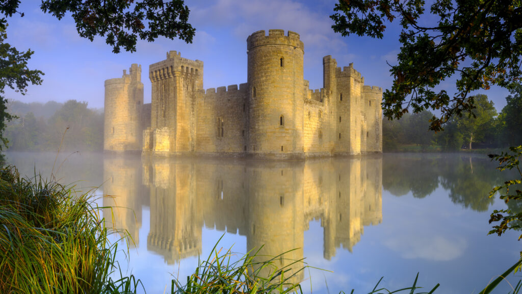 Autumn misty sunrise on Bodiam Castle, East Sussex, UK