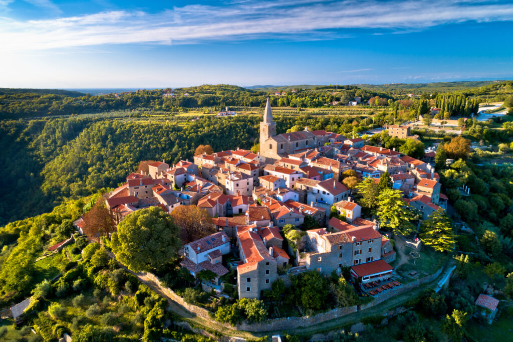 Ancient hill village of Groznjan aerial panoramic view, artist colony in Istria region of Croatia
