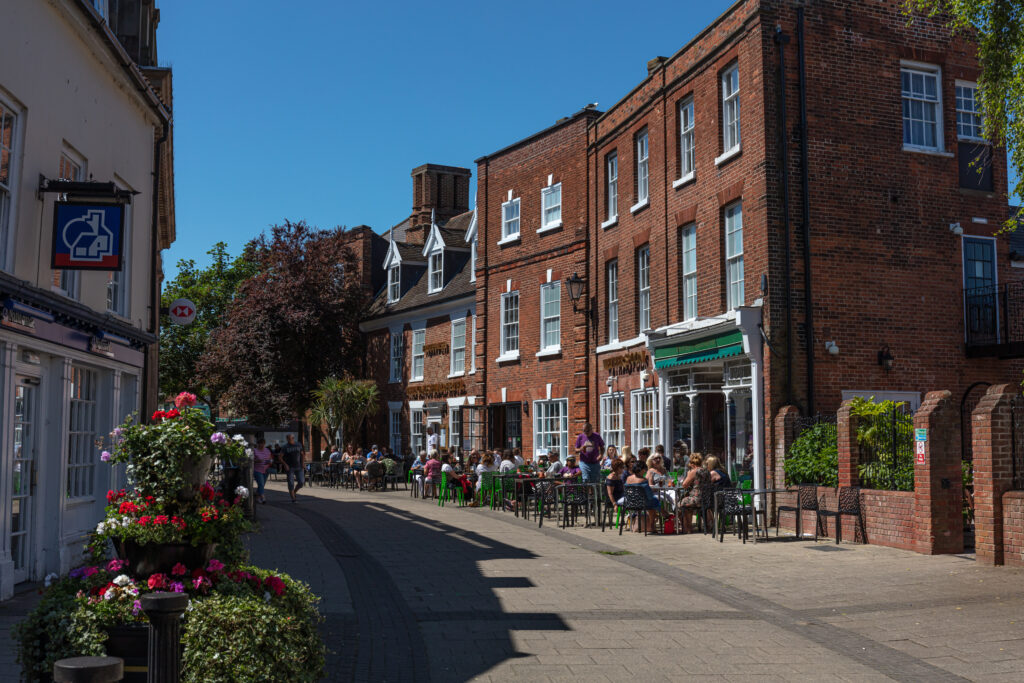 People enjoying food and drink sat outside the Kings Head Hotel in Beccles on a lovely summer day