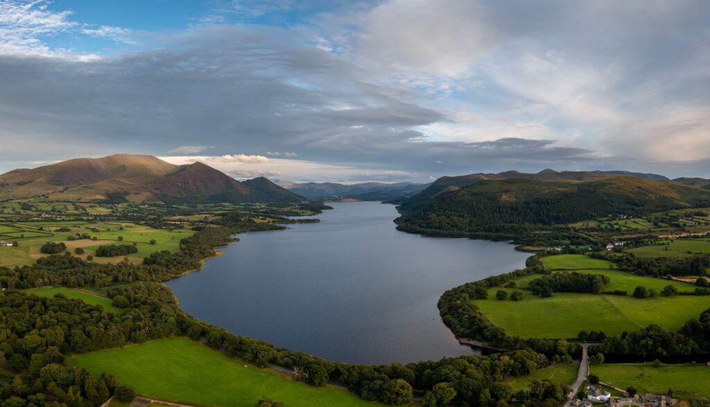 An aerial view of Bassenthwaite Lake in the English Lake District in warm eveing light