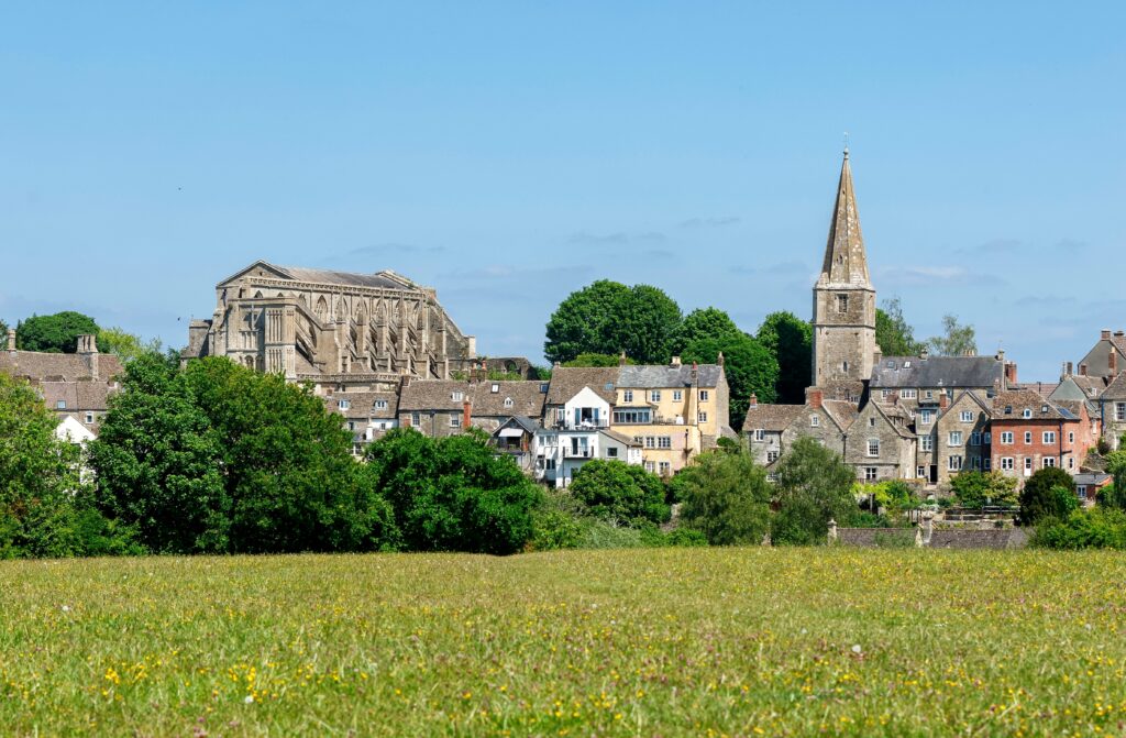 View of the historic town of Malmesbury from the surrounding fields. Malmesbury Abbey. 