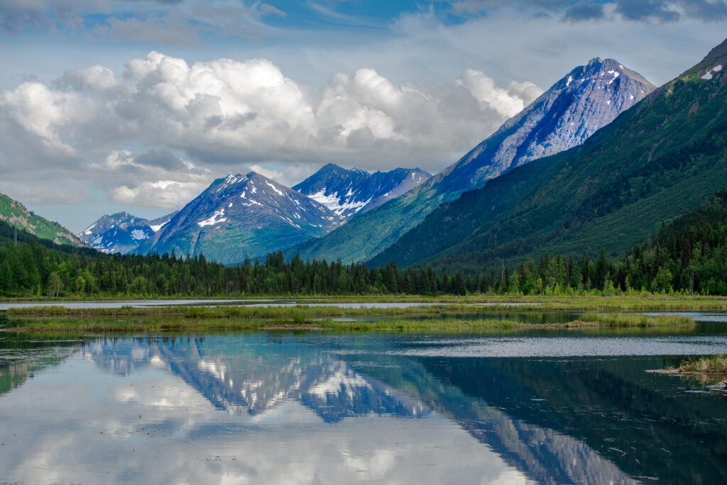 The Kenai Mountains reflecting in the Kenai Lake near Cooper's Landing, Alsaka, USA.