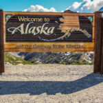 The Welcome to Alaska and the Gateway to the Klondike sign