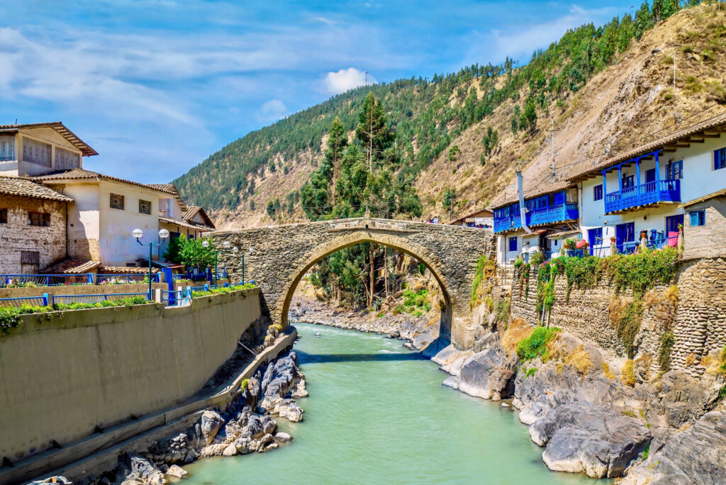 The picturesque colonial Carlos Tercero bridge, built in 1775, spanning the Mapacho River in the town of Paucartambo, in the Cusco region in southern Peru.