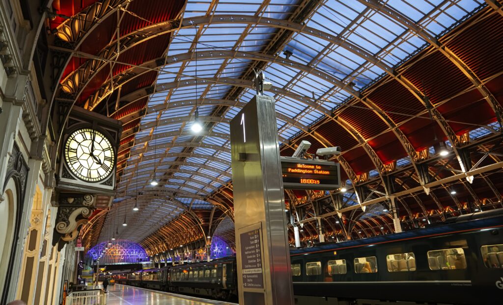 Paddington railway train station in London. Close up view with the iconic clock. Transportation industry in England