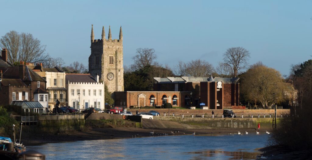 This panoramic image shows All Saints Church at the Thames riverfront of Old Isleworth