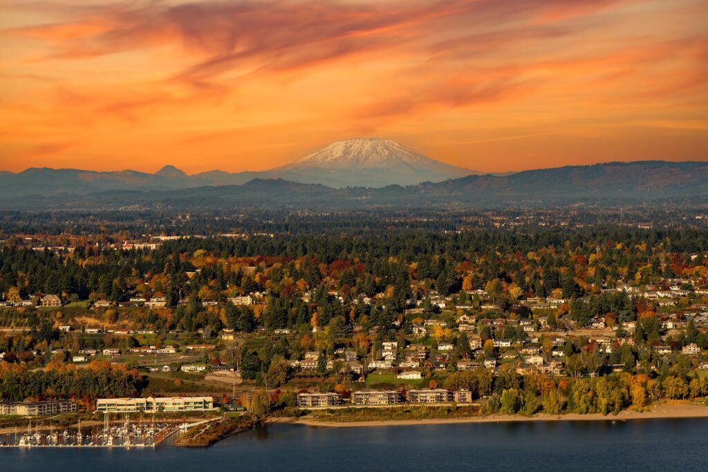 Mt Saint Helens, the columbia river, a boat mooring facility and fall color trees in Vancouver, Washington.