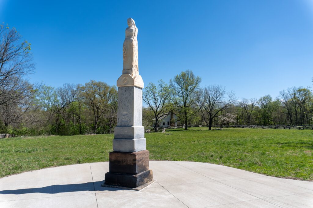 Pea Ridge National Military Park, battlefield of US Civil War Battle of Pea Ridge. Reunited Soldiery Monument with Elkhorn Tavern in background
