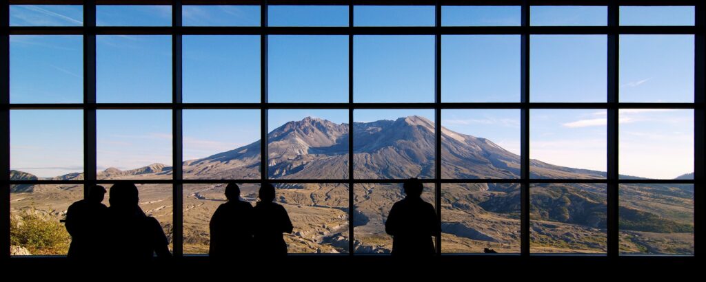 Visitors look at Mount St. Helens from the Johnston Ridge Observatory