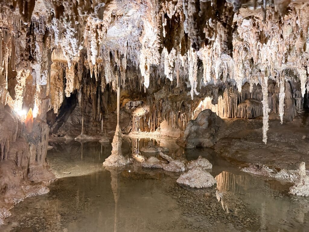 Lehman Caves interior at Great Basin National Park. Stalagtites, Stalagmites and underground lake in the dark