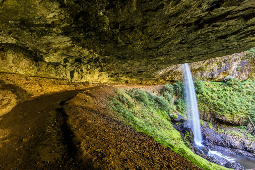 North Silver Falls Oregon.
the trail takes you behind this beautiful waterfall with a huge cave like overhang. 
Silver falls state park, Oregon
