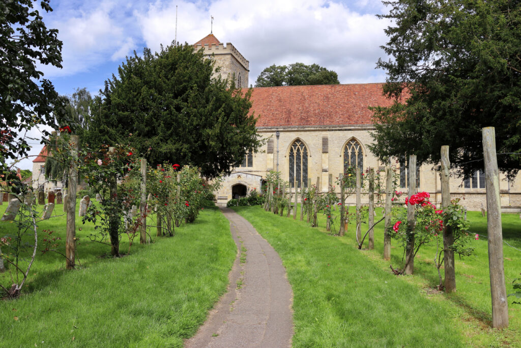Rose lined path leading to Dorchester on Thames Abbey