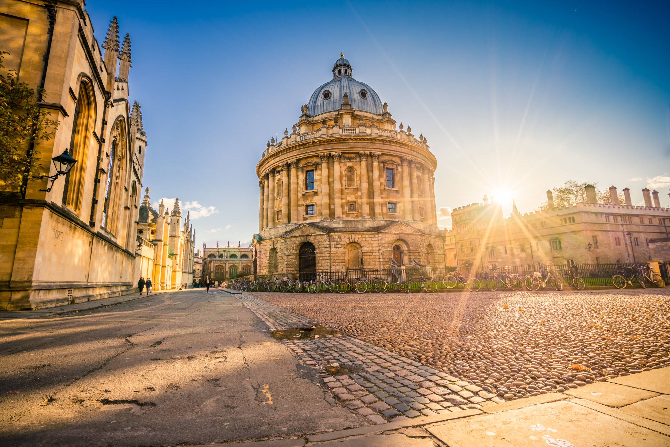 Radcliffe square with Science Library and sunset flare in Oxford, England