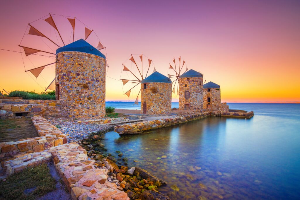 Old windmills by the beach, Chios island, Greece.
