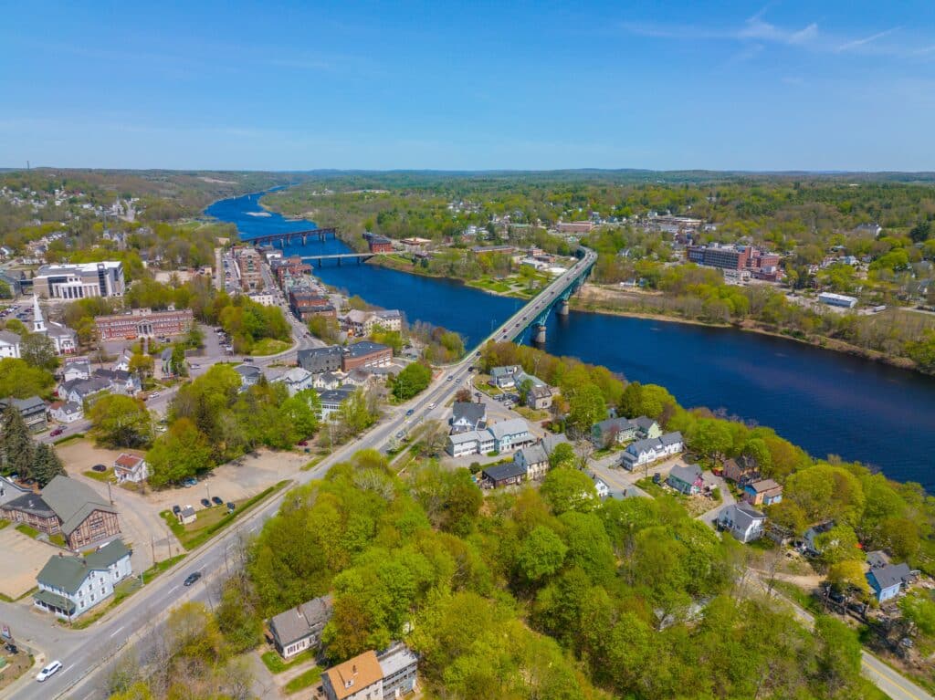 Memorial Bridge aerial view over Kennebec River in historic downtown of Augusta, Maine ME, USA.