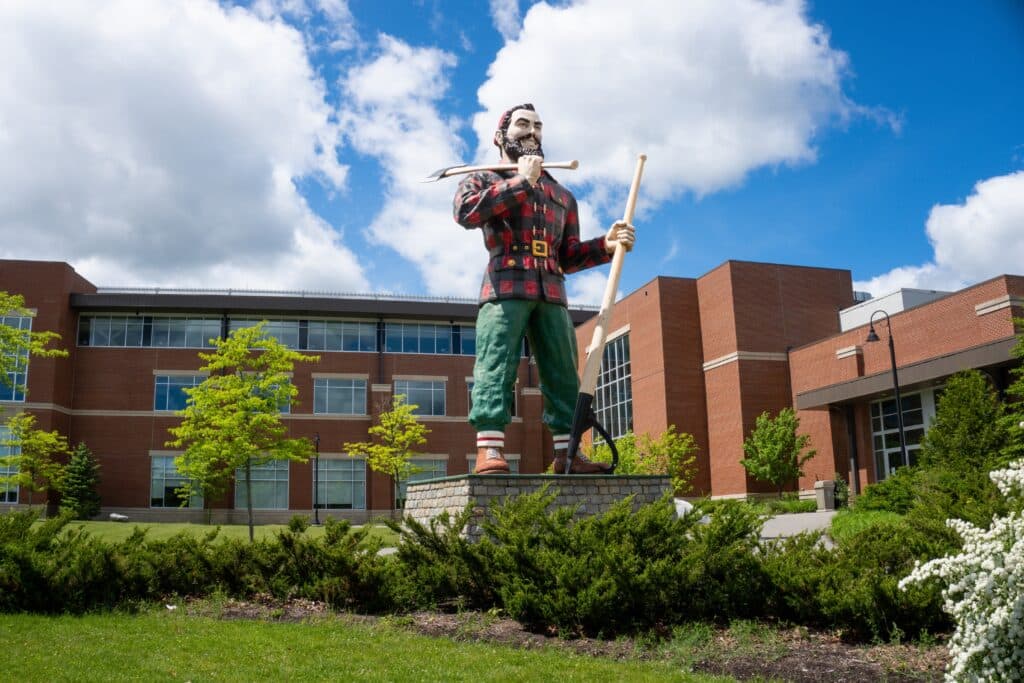 Bangor, Maine: Paul Bunyan holding double-sided ax and lumberjack's peavey. Giant statue in town claiming to be birthplace to the legendary lumberjack.