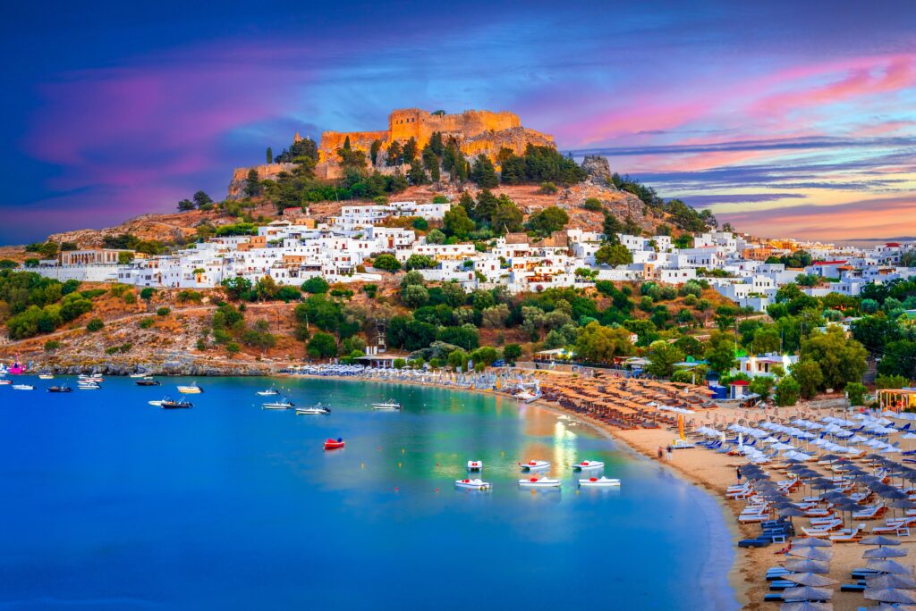 Lindos city on Rhodes island, Greece. Small whitewashed village and the Acropolis, on Rhodos Island, Greece at Aegean Sea