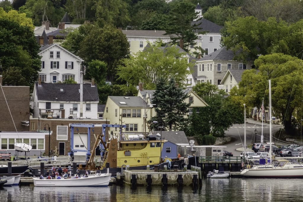 CASTINE, MAINE/USA: Student mariners (lower left) prepare to leave a launch in Castine, an historic town and tourist destination that is home to the Maine Maritime Academy.