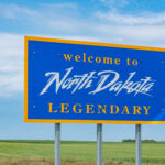 North Dakota welcome sign along the highway at the state border