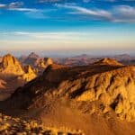 Hoggar landscape in the Sahara desert, Algeria. A view of the mountains and basalt organs that stand around the dirt road that leads to Assekrem.