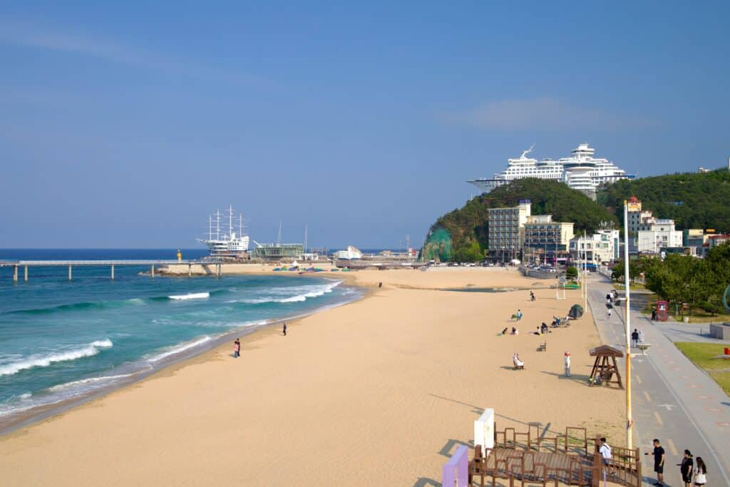 Sandy beach in Gangneung with ocean waves and seaside promenade