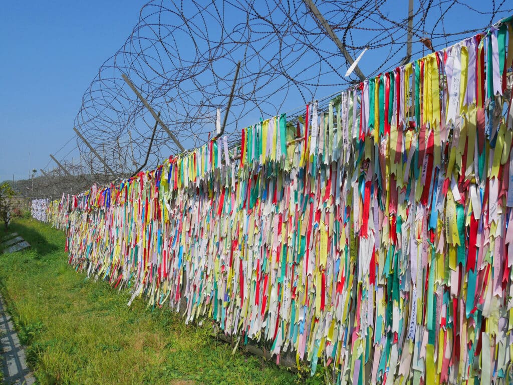 Colorful peace ribbons tied to a fence near the Korean Demilitarized Zone (DMZ) in South Korea