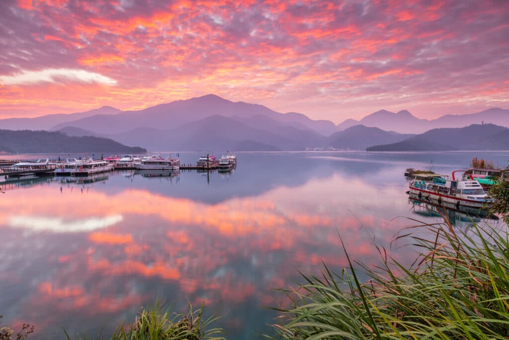 Asia culture - Beautiful landscape of lake level reflect fantasy dramatic sunrise sky in Sun Moon Lake , in Taiwan, Asia. the famous travel attractions in Nantou ,Taiwan. Scenery of Sun Moon Lake
