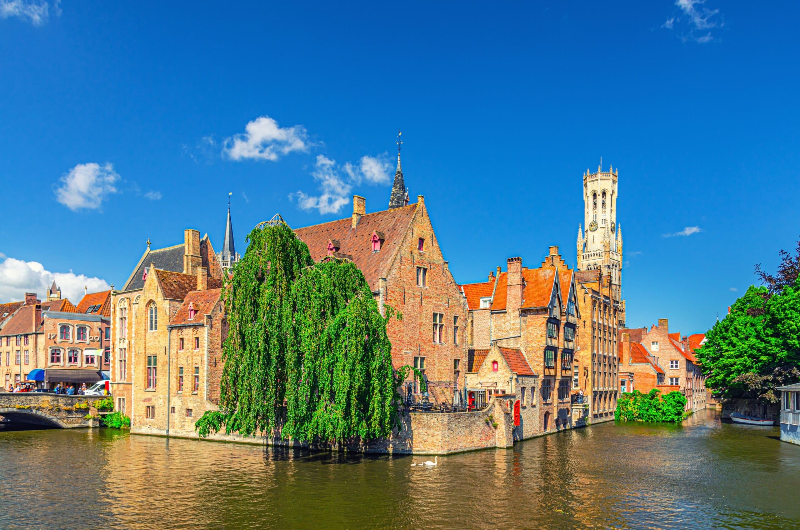Bruges cityscape, Brugge old town scenic view quarter historical city centre, Rosary Quay Rozenhoedkaai embankment, Belfort Belfry tower, Dijver water canal of Reie river, Flemish Region, Belgium