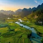 Aerial landscape in Phong Nam valley cinematic sunset, Cao bang province, Vietnam with river, nature, rice fields, beautiful destination in Northern Vietnam. Travel and landscape concept.
