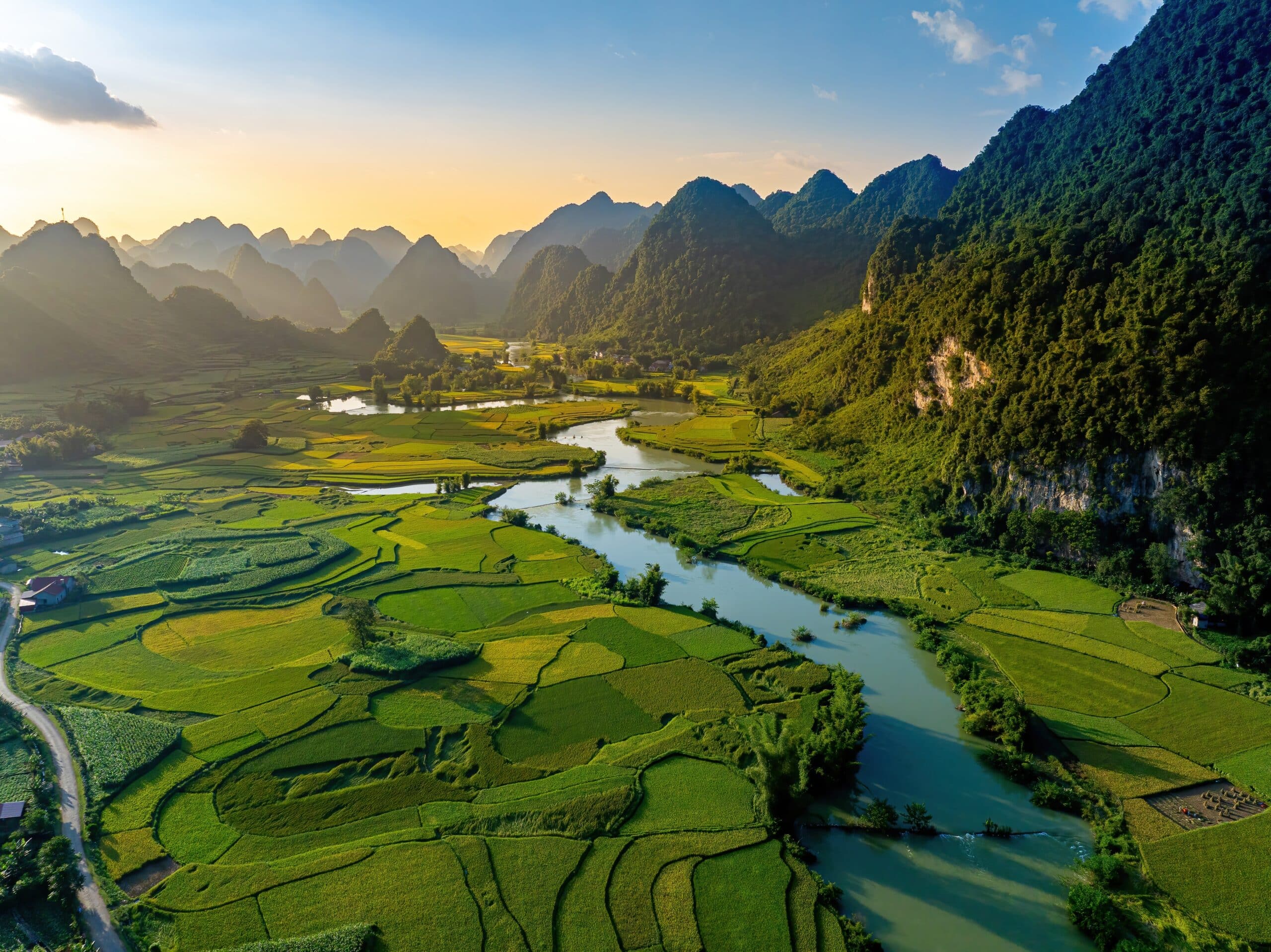 Aerial landscape in Phong Nam valley cinematic sunset, Cao bang province, Vietnam with river, nature, rice fields, beautiful destination in Northern Vietnam. Travel and landscape concept.