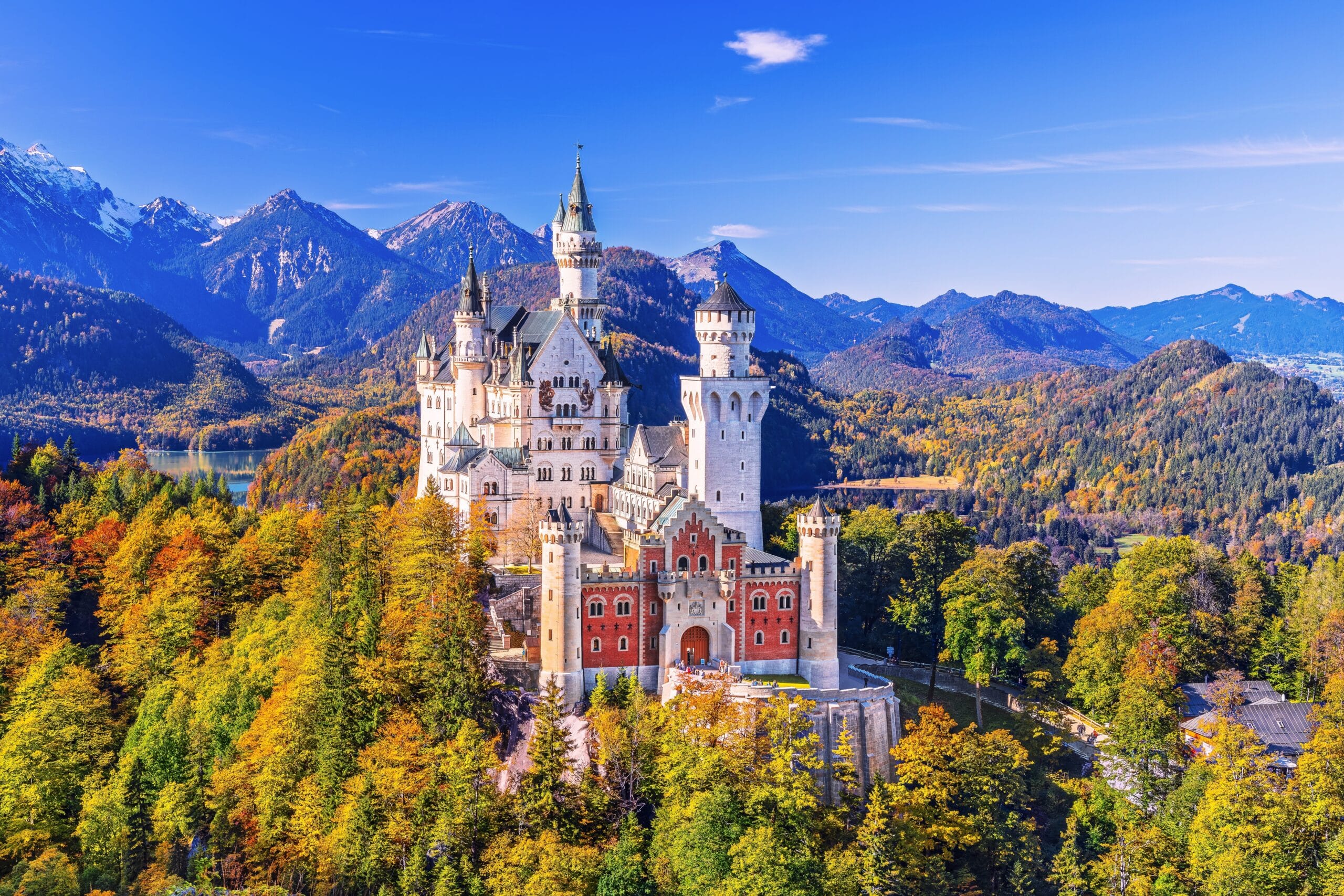 Neuschwanstein Castle (Schloss Neuschwanstein) Bavaria. Fussen, Germany. Front view of the castle. The Bavarian Alps in the background.