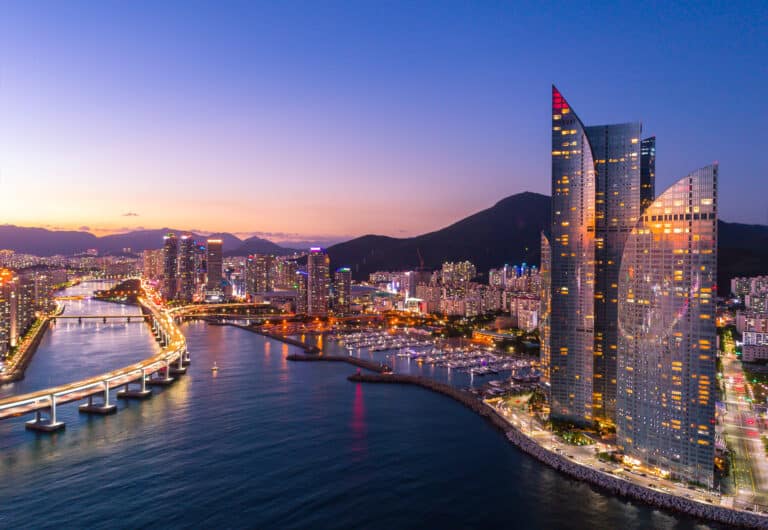 Modern skyscrapers in Busan Marine City with coastal skyline at sunset