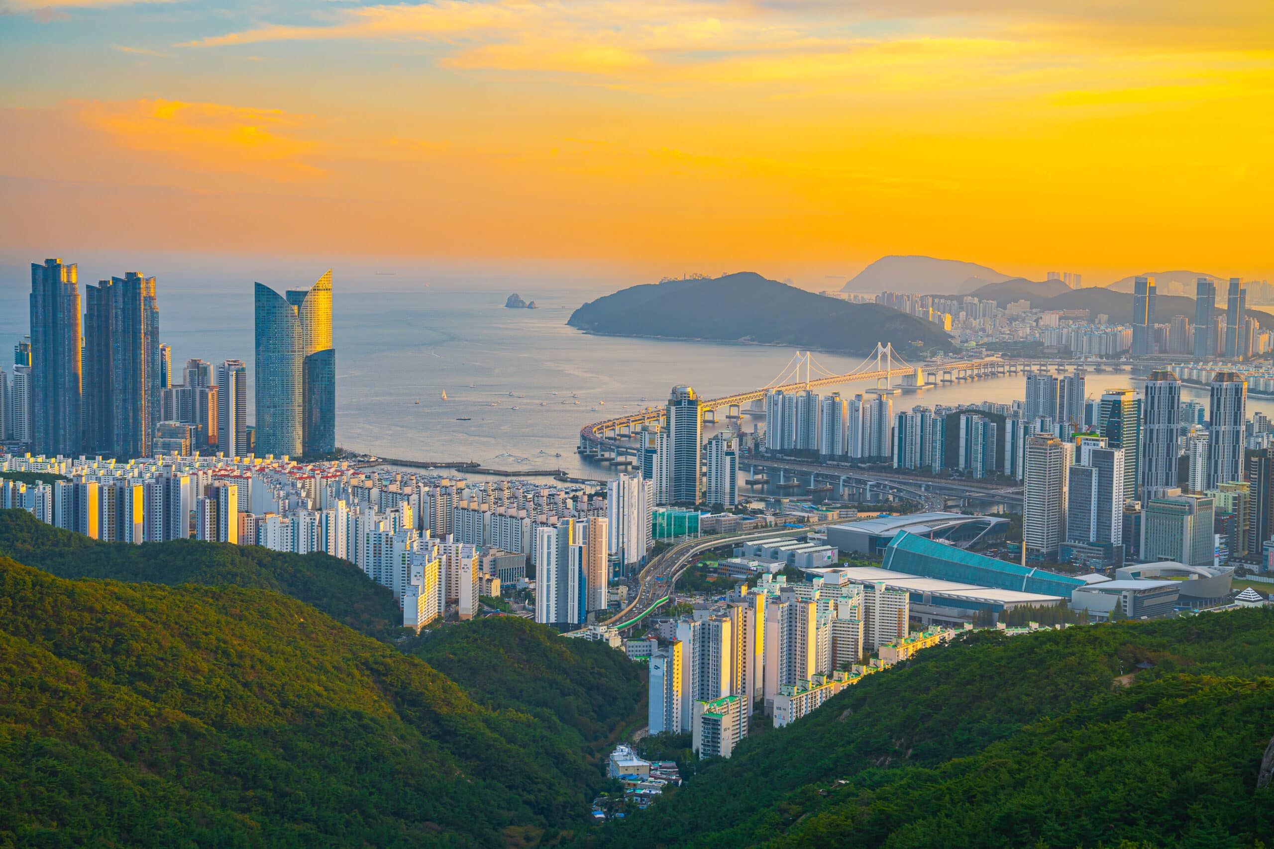 Busan skyline with Gwangan Bridge and ocean view at sunset from elevated viewpoint
