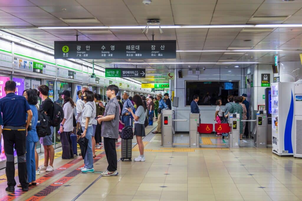 People waiting at Busan subway station platform