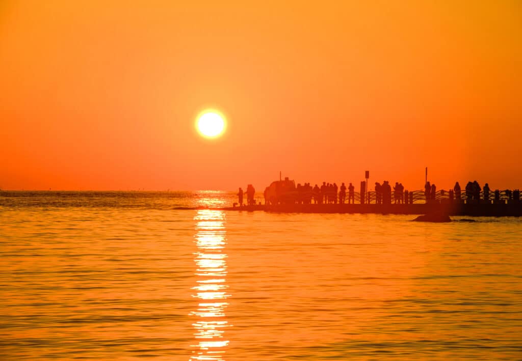 Sunset view over the sea at Eurwangni Beach near Incheon with silhouettes